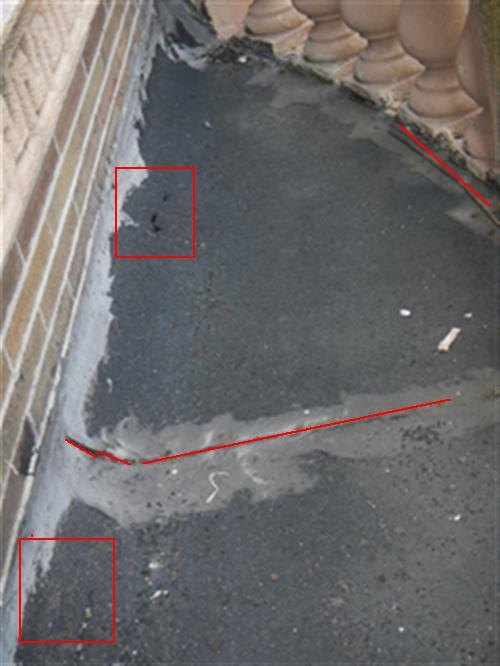 Balcony roof surface behind a stone balustrade, with red boxes and lines marking cracked, worn areas
