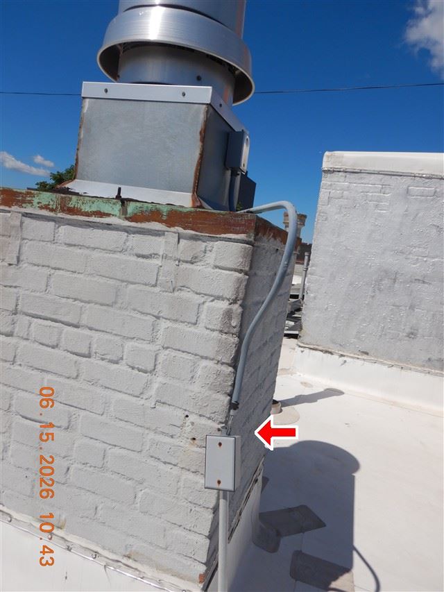 Chimney and flue cap at roof level. Venting is checked from both ends.