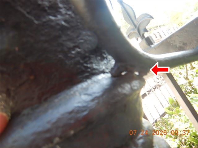 Corroded structural steel photographed during an inspection.