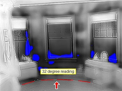 A thermal image of a window reveal, showing where heat is leaving that the eye cannot see.