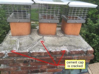 Brick chimney with three clay flues and metal caps, red arrows labelled cement cap is cracked
