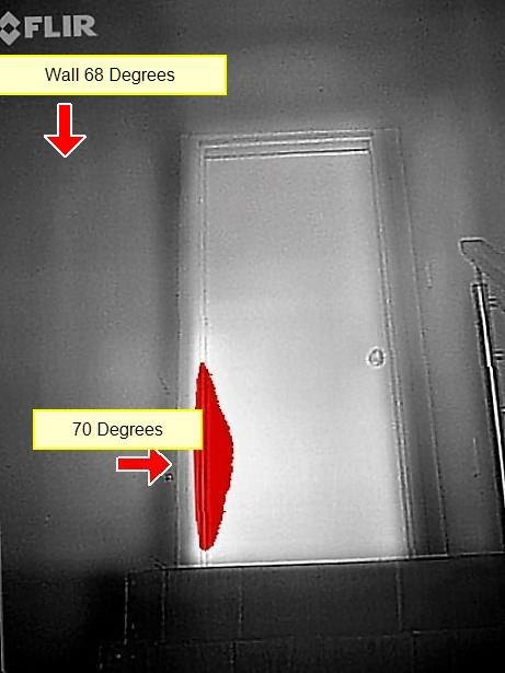 A thermal-camera image of a door and wall with temperature labels showing 68 and 70 degrees and a warm spot at the door edge